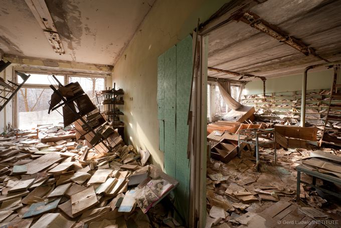 Books rot in a former school library in the ghost town of Pripyat